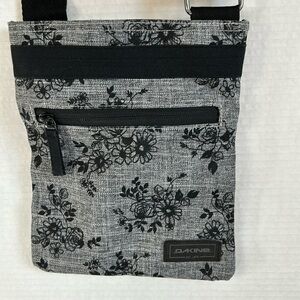 Dakine Jive crossbody bag. Black and gray floral print.